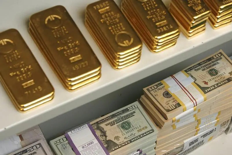 Image used for illustrative purpose. Gold bars and US Dollar bills are pictured in a safe in a bank in Vienna July 21, 2009. Heinz-Peter Bader, Reuters , Reuters Images