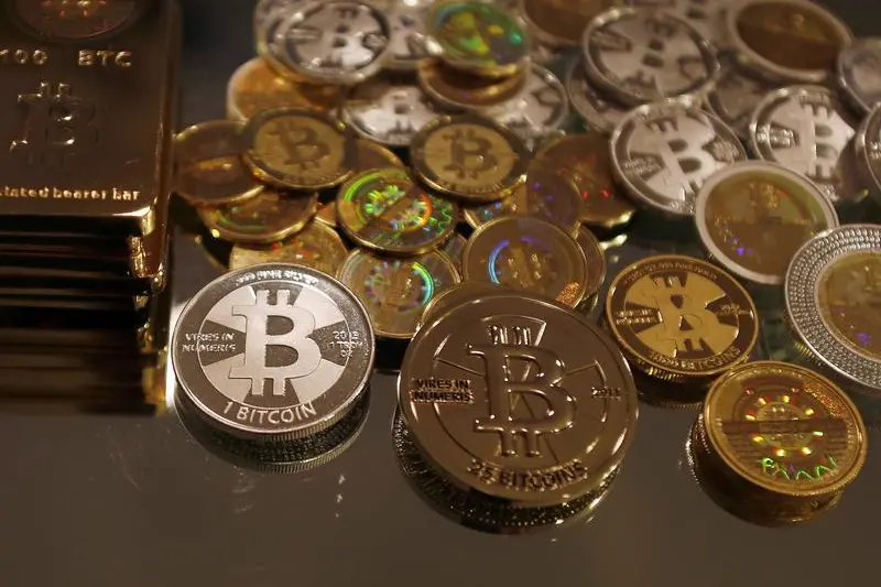 Bitcoins created by enthusiast Mike Caldwell are seen in a photo illustration at his office in Sandy, Utah, September 17, 2013. Technology underlying crypto-currencies, financial technologies are beneficial to banking sector, UAE central bank governor said. , Reuters Images/Jim Urquhart  