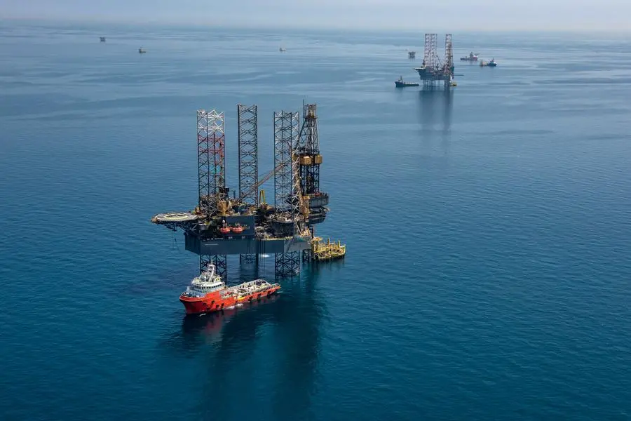 A handout picture provided by Energy giant Saudi Aramco, Saudi Arabia\\'s state-owned oil and gas company, shows its rigs in HSBH field north of Dhahran in the eastern province of Saudi Arabia on March 20, 2018. (Photo by Mohamed ALEBN ALSHAIKH / Saudi Aramco / AFP) Image used for illustrative purpose.