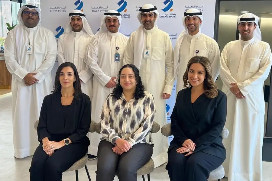 A group photo of Burgan Bank\\'s employees, holders of the Advanced Certificate in Credit Management. Image Courtesy: Burgan Bank