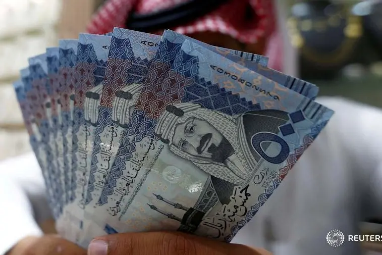 A Saudi money changer displays Saudi Riyal banknotes at a currency exchange shop in Riyadh, Saudi Arabia July 27, 2017. Faisal Al Nasser, Reuters , Reuters Images