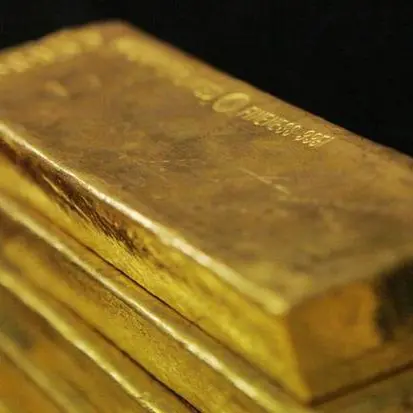 Gold eases as dollar firms after Fed meeting, Powell comments
