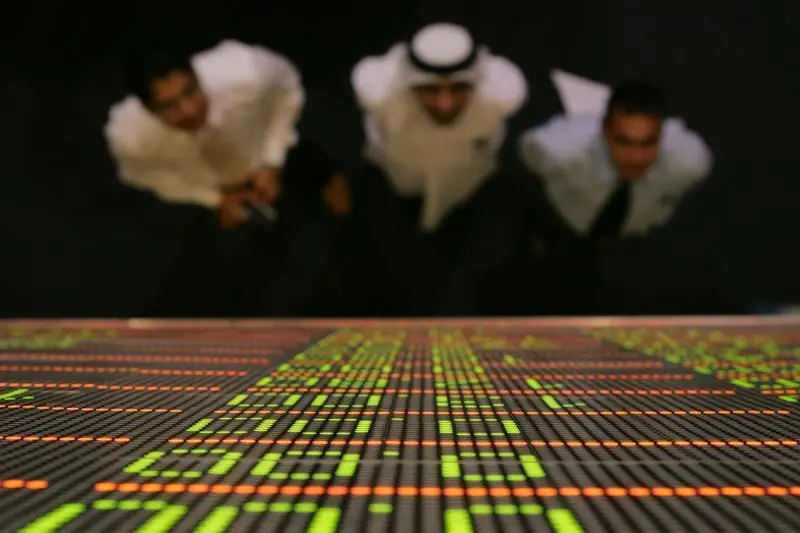 Traders watch a quotation board at the Dubai stock exchange. Image used for illustrative purpose. , Reuters Images/STR New