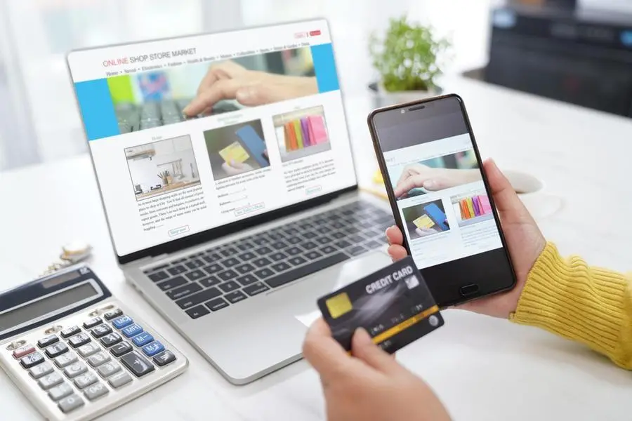 Image used for illustrative purpose. Online shopping woman used computer laptop searching shop on e-commerce website and using smartphone to payment on digital payment online gateway by credit card. , Getty Images