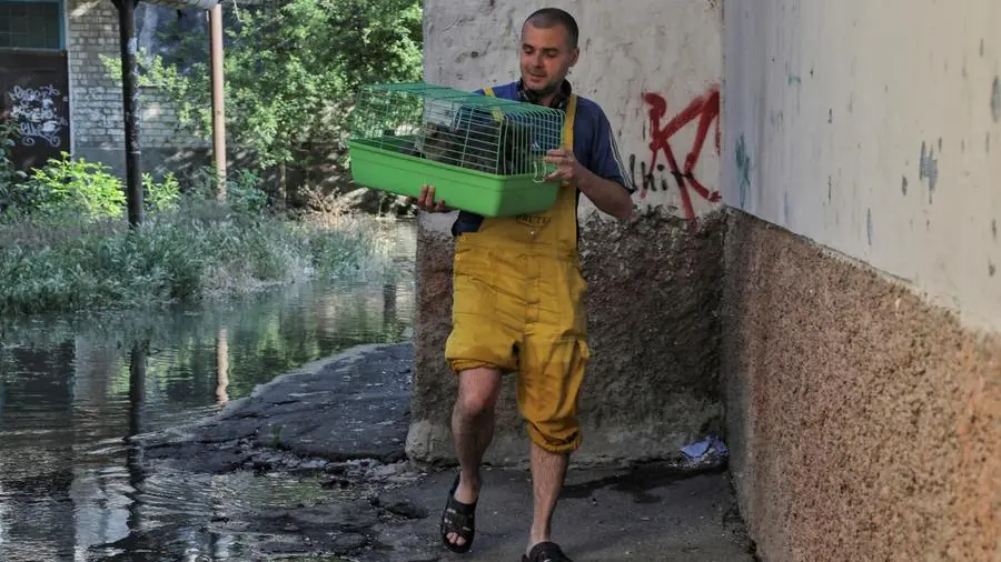 Ukrainians flee rising waters after destruction of massive dam