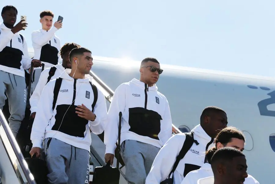 Soccer Football - Paris St Germain arrive in Riyadh ahead of their friendly match v Saudi Pro League XI - King Khalid International Airport, Riyadh, Saudia Arabia - January 19, 2023 Paris St Germain's Kylian Mbappe and Achraf Hakimi arrive in Saudi Arabia ahead of the match REUTERS/Ahmed Yosri