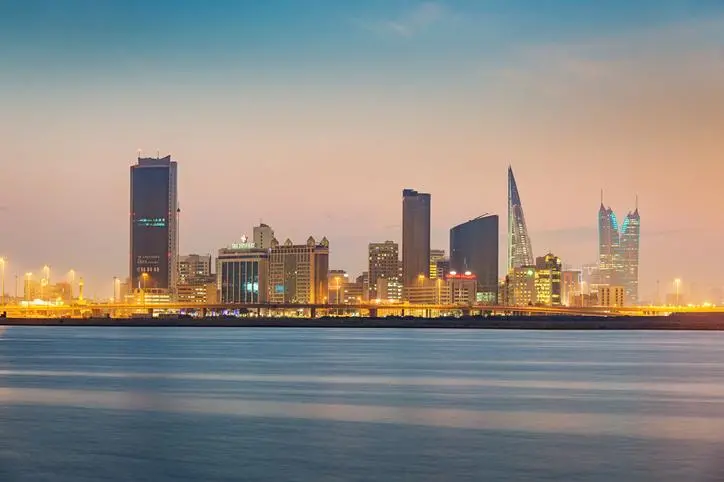 Bahrain Manama Skyline at Twilight, Manama Cityscape with office buildings, hotels and the world trade center of the capital of Bahrain illuminated at night under beautiful skyscape. Manama, Bahrain, Middle East. , Getty Images/Getty Images