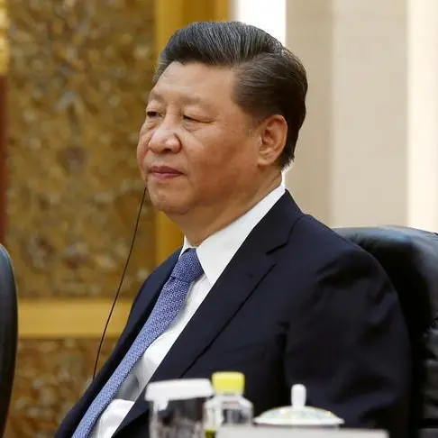 China's Xi meets Uruguay president, upgrades ties