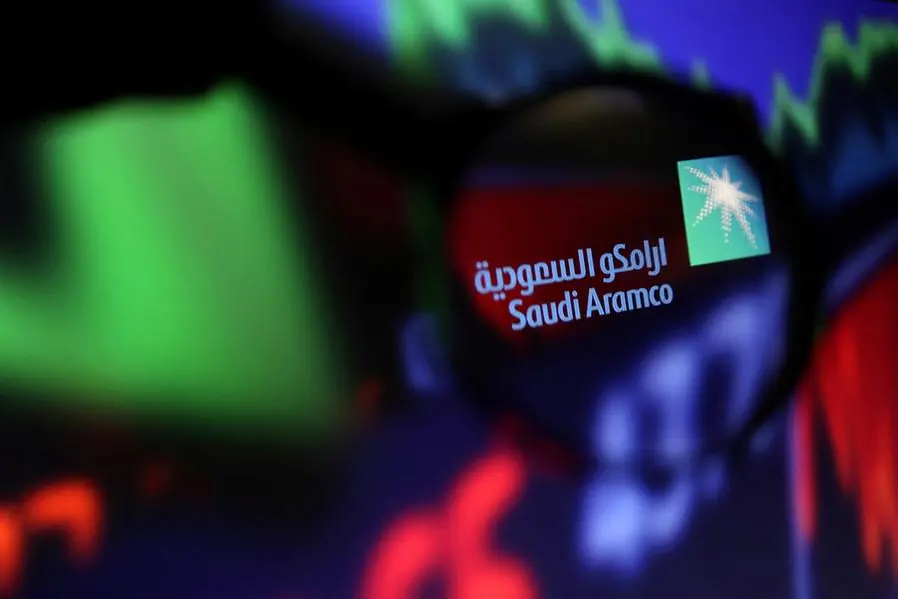 FILE PHOTO: Saudi Aramco logo and stock graph are seen through a magnifier displayed in this illustration taken September 4, 2022. REUTERS/Dado Ruvic/Illustration/File Photo , Reuters