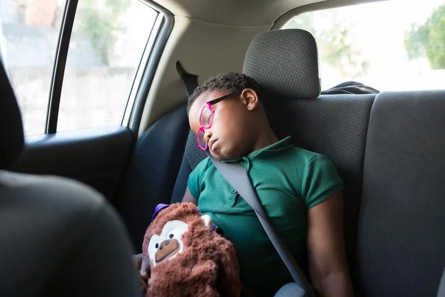 Child in front seat of outlet car