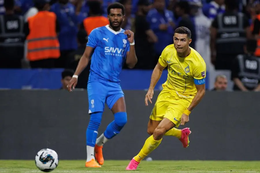Nassr's Portuguese forward #07 Cristiano Ronaldo runs after the ball during the 2023 Arab Club Champions Cup final football match between Saudi Arabia's Al-Hilal and Al-Nassr at the King Fahd Stadium in Taif on August 12, 2023. (Photo by AFP)