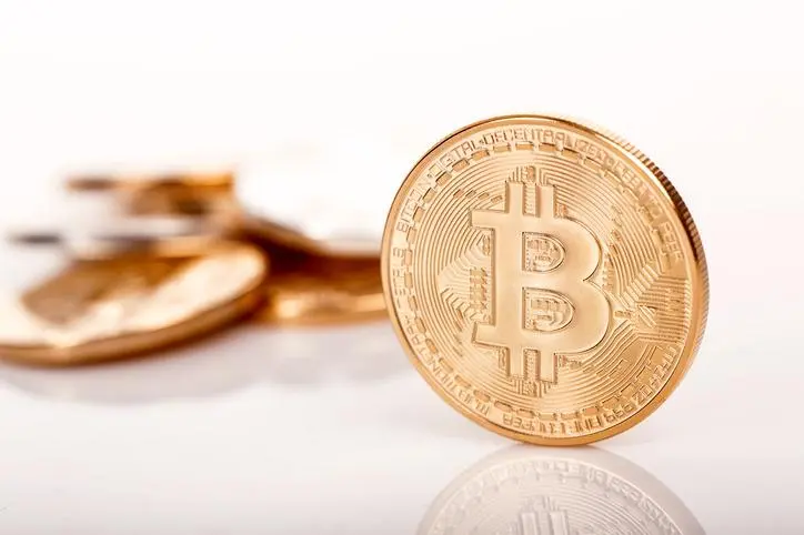 Sofia, Bulgaria - April 24, 2014: Studio shot of golden Bitcoin coins, virtual currency. One bitcoin front view. , Getty Images/Getty Images