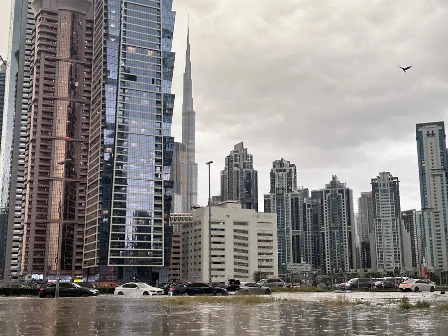 A general view of floods caused by heavy rains, with the Burj Khalifa tower visible in the background, in Dubai, United Arab Emirates, April 16, 2024. REUTERS/Abdelhadi Ramahi