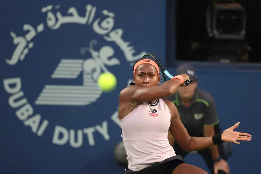 Coco Gauff of the US returns the ball to Iga Swiatek of Poland (not pictured) during their semi-final WTA Dubai Duty Free Tennis Championship match in Dubai, on February 24, 2023. (Photo by Karim SAHIB / AFP) , Agence France-Presse (AFP)/AFP
