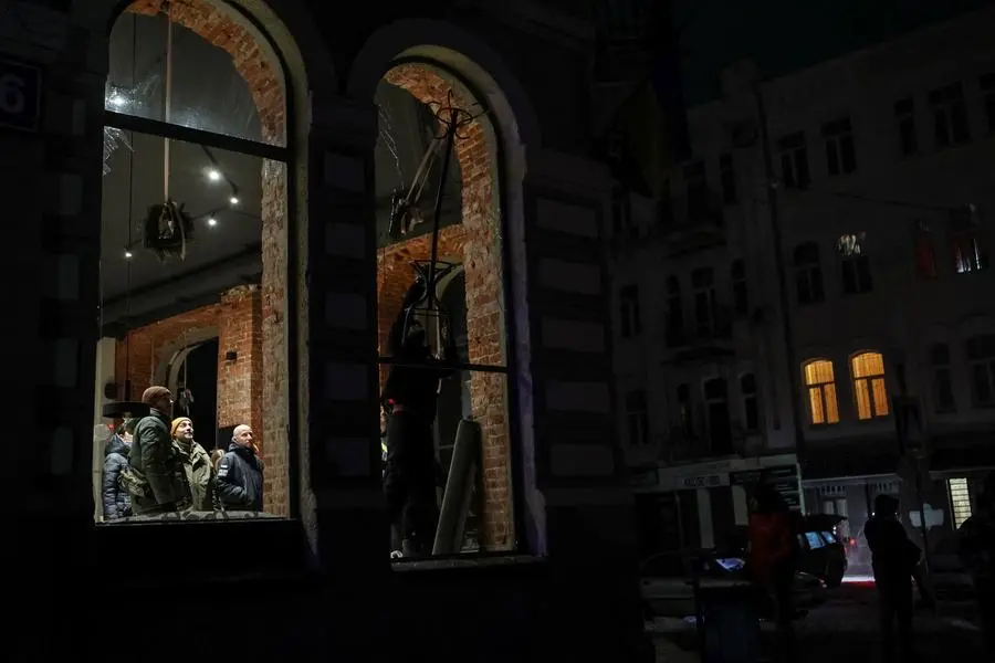 A local resident removes a broken window in a cafe damaged during a Russian missile attack, amid Russia\\'s attack on Ukraine, in central Kharkiv, Ukraine January 24, 2024. REUTERS/Sofiia Gatilova , Reuters
