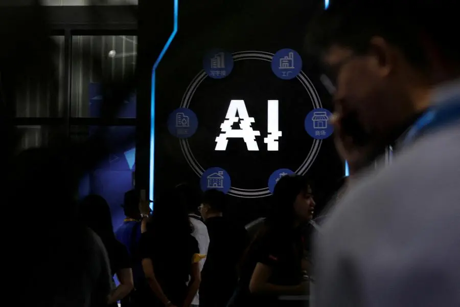 FILE PHOTO: Visitors stand near a sign of artificial intelligence at an AI robot booth at Security China, an exhibition on public safety and security, in Beijing, China June 7, 2023. REUTERS/Florence Lo/File Photo , Reuters/REUTERS