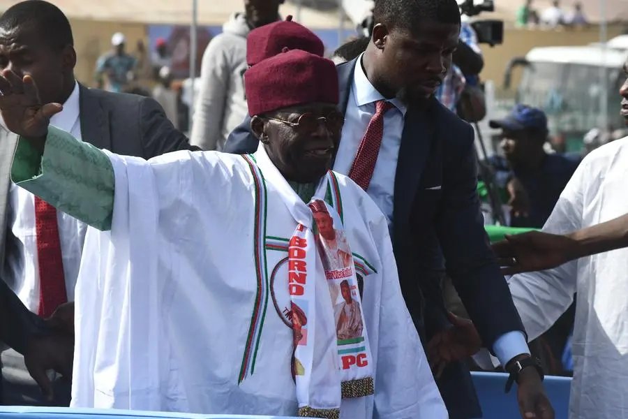 Presidential candidate of All progressives Congress party (APC) Asiwaju Bola Ahmed Tinubu (C) arrives at the party rally in Maiduguri on February 18, 2023 ahead of the Nigerian presidential elections scheduled for February 25, 2023. (Photo by Audu MARTE / AFP)