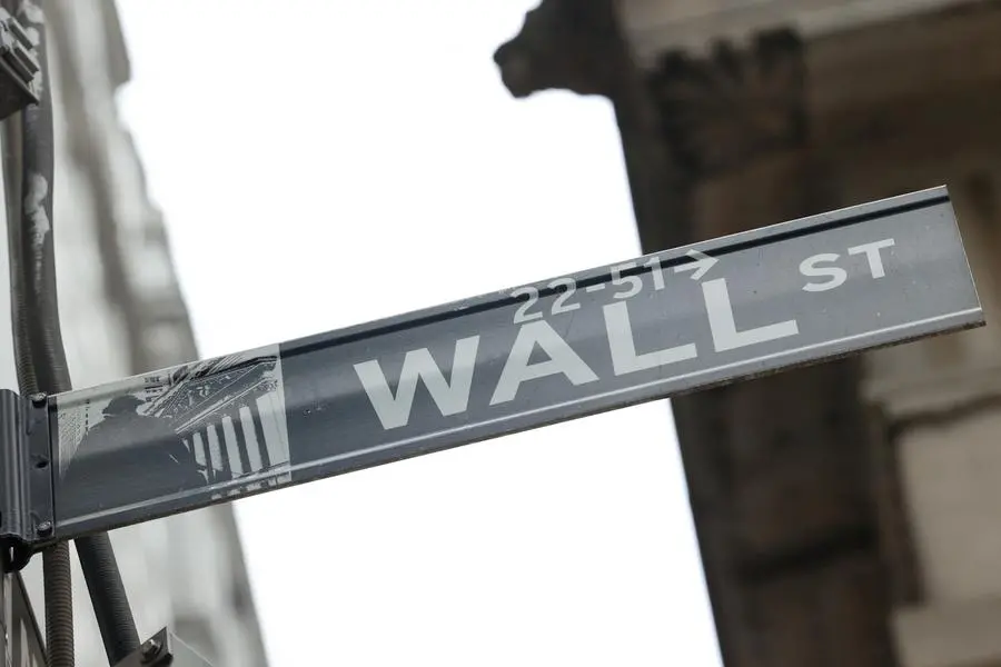 FILE PHOTO: A street sign marks Wall Street outside the New York Stock Exchange (NYSE) in New York City, where markets roiled after Russia continues to attack Ukraine, in New York, U.S., February 24, 2022. REUTERS/Caitlin Ochs/File Photo , Reuters