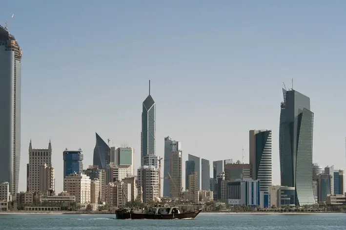 A fishing boat passes in front of the Kuwait City skyline. Stephanie McGehee, Reuters. Image used for illustrative purpose.