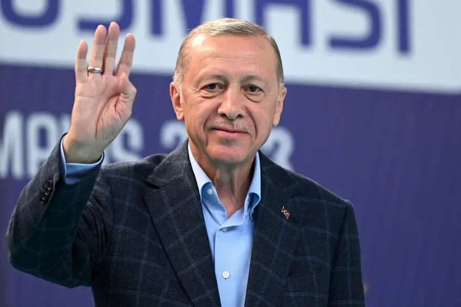 Turkish President Recep Tayyip Erdogan waves to supporters prior to address a speech at a rally in the Beyoglu district on the eve of the presidential and parliamentary elections, on the European side of Istanbul, on May 13, 2023. Erdogan warned his conservative supporters they could face reprisals should his secular rival rise to power in momentous weekend polls. Erdogan has been trying to rally his base ahead of elections that put his Islamic style of rule in the largest Muslim-majority member of NATO on the line. (Photo by OZAN KOSE / AFP) , Agence France-Presse (AFP)/AFP