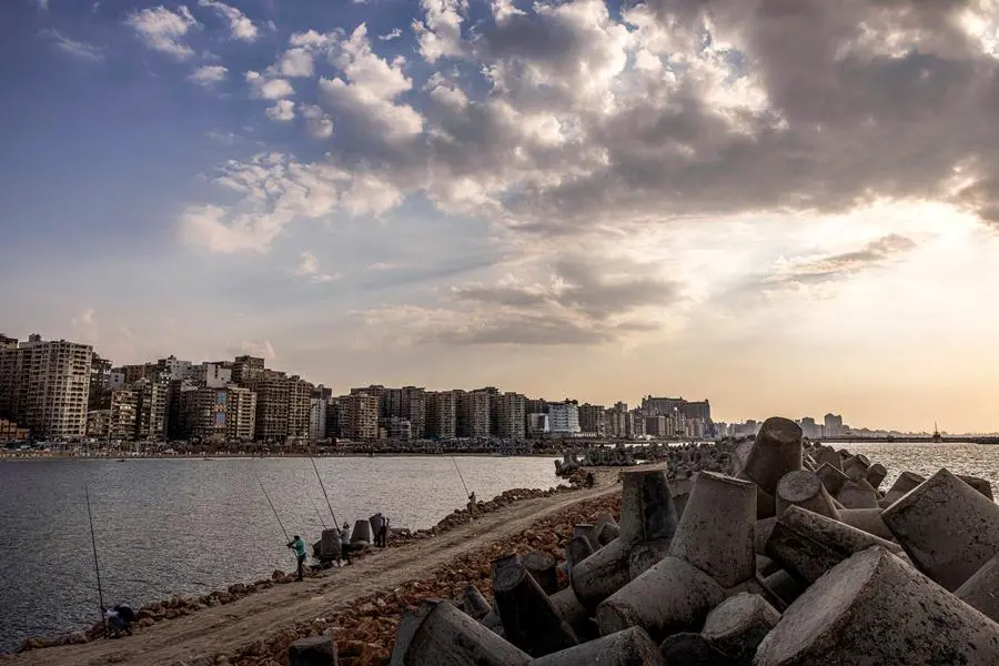 This picture taken on October 31, 2022 shows some of thousands of concrete blocks installed to break the Mediterranean sea waves along the waterfront in Egypt's northern Mediterranean coastal city of Alexandria. - With global warming, rising sea levels and sinking land, Egypt could lose one of its treasures: the second city of Alexandria, along with its historic and ancient ruins. Its millions of inhabitants will have no choice but climate exile. Already, hundreds of Alexandrians have had to leave apartments weakened by flooding, once in 2015 and again in 2020. They are the first of a long line, warns Egypt's ministry of water resources and irrigation. (Photo by Khaled DESOUKI / AFP)
