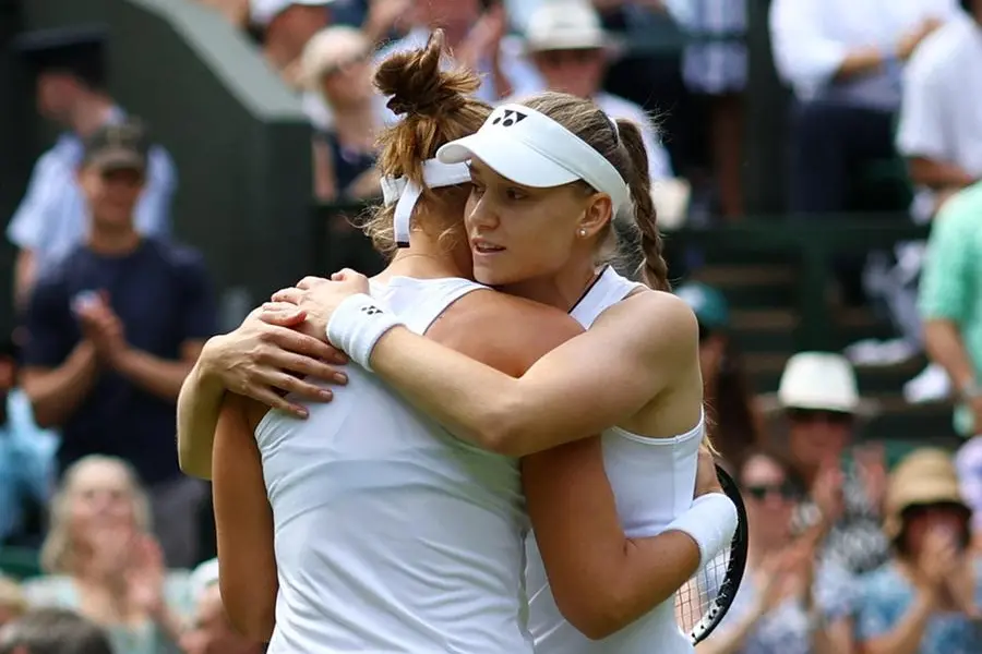 Tennis - Wimbledon - All England Lawn Tennis and Croquet Club, London, Britain - July 10, 2023 Kazakhstan\\'s Elena Rybakina embraces Brazil\\u2019s Beatriz Haddad Maia after she retired after sustaining an injury in their fourth round match REUTERS/Hannah Mckay , Reuters/REUTERS
