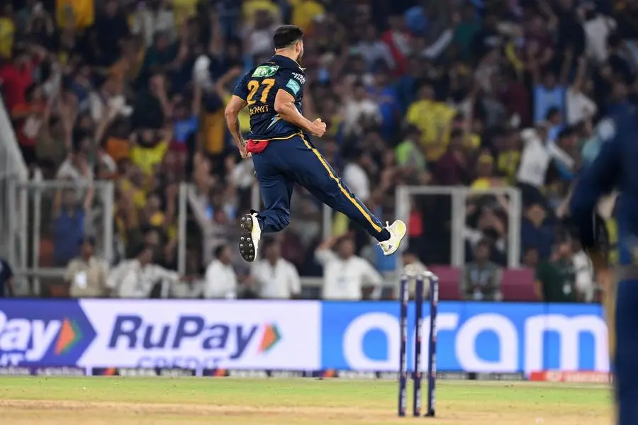 Gujarat Titans' Mohit Sharma celebrates after taking the wicket of Chennai Super Kings' captain Mahendra Singh Dhoni (not pictured) during the Indian Premier League (IPL) Twenty20 final cricket match between Gujarat Titans and Chennai Super Kings at the Narendra Modi Stadium in Ahmedabad on May 30, 2023. (Photo by Sajjad HUSSAIN / AFP)