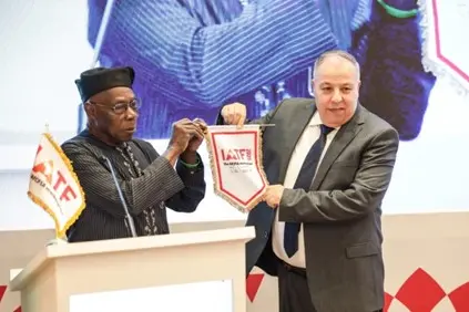 Chief Olusegun Obasanjo, Chairman of the Advisory Council of the Intra-African Trade Fair and former President of Nigeria handing over the IATF flag to Abdelaziz Benali Cherif, Algerian Ambassador to Egypt