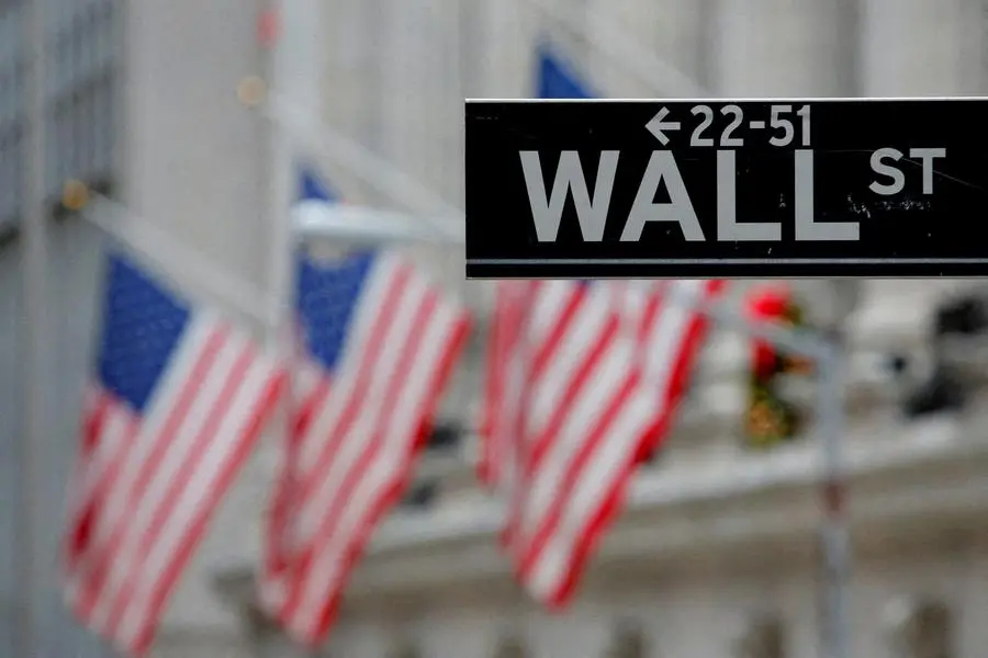 FILE PHOTO: A street sign for Wall Street is seen outside the New York Stock Exchange (NYSE) in Manhattan, New York City, U.S. December 28, 2016. REUTERS/Andrew Kelly/File Photo , Reuters/REUTERS