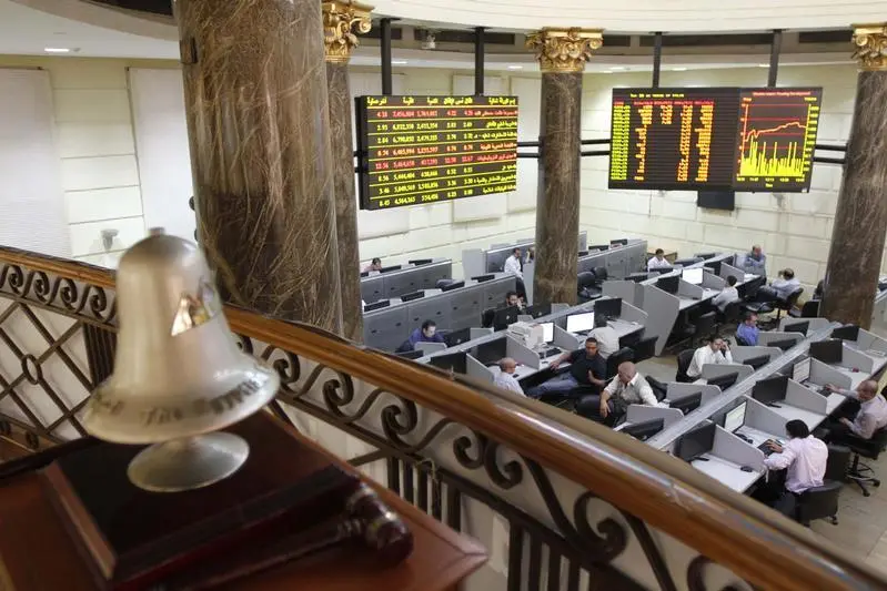 Image used for illustrative purpose. Traders work near the exchange bell at Egypt\\'s Stock Exchange in Cairo July 3, 2013. Mohamed Abd El Ghany, Reuters , Reuters Images