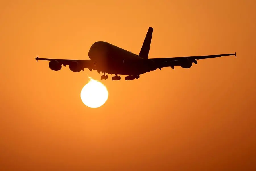 An Emirates Airlines plane lands at Dubai International Airport at sunrise in Dubai on October 17, 2023. (Photo by Karim SAHIB / AFP) Image used for illustrative puropse.