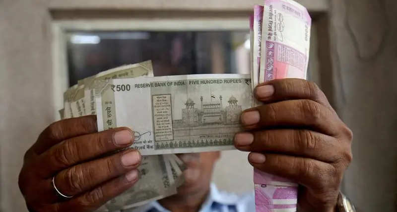 Rupee ends lower pressured by broad dollar rally, notches weekly decline