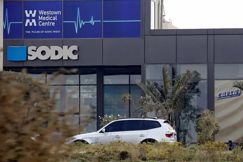 A car drives past Egyptian developer SODIC headquarters building on the outskirts of Cairo, Egypt November 13, 2016. , Reuters Images/Amr Abdallah Dalsh 