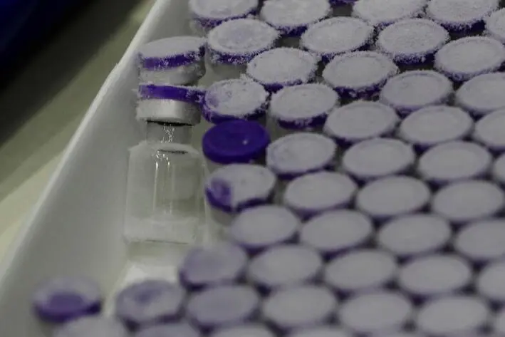Vials taken out from a pharmaceutical refrigerator are pictured during a mock inoculation exercise, as Japan prepares for coronavirus disease (COVID-19) vaccination campaign, at a college gym in Kawasaki, south of Tokyo, Japan, January 27, 2021. REUTERS/Kim Kyung-Hoon , Reuters Images/REUTERS