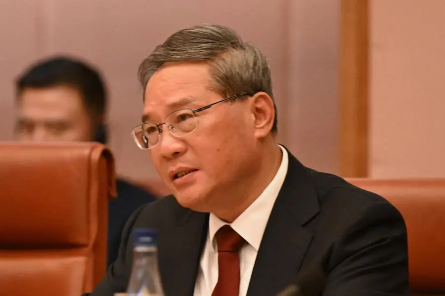 Chinese Premier Li Qiang speaks to Australian Prime Minister Anthony Albanese (not pictured) during the Annual Leaders\\u2019 Meeting at the Australian Parliament House in Canberra, Australia June 17, 2024. LUKAS COCH/Pool via REUTERS