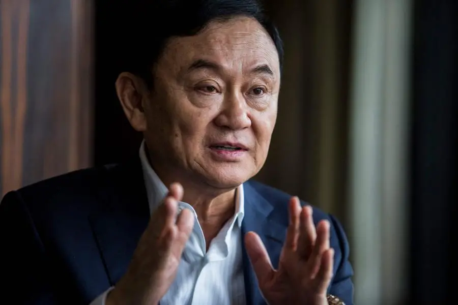 (FILES) This picture taken on March 25, 2019, shows exiled former Thai prime minister Thaksin Shinawatra being interviewed by Agence France-Presse (AFP) in Hong Kong. Thailand\\'s political deadlock shows no signs of ending anytime soon, as months after national elections the kingdom\\'s lawmakers broker, bicker and break alliances with a new prime minister nowhere to be seen. (Photo by ISAAC LAWRENCE / AFP) , Agence France-Presse (AFP)