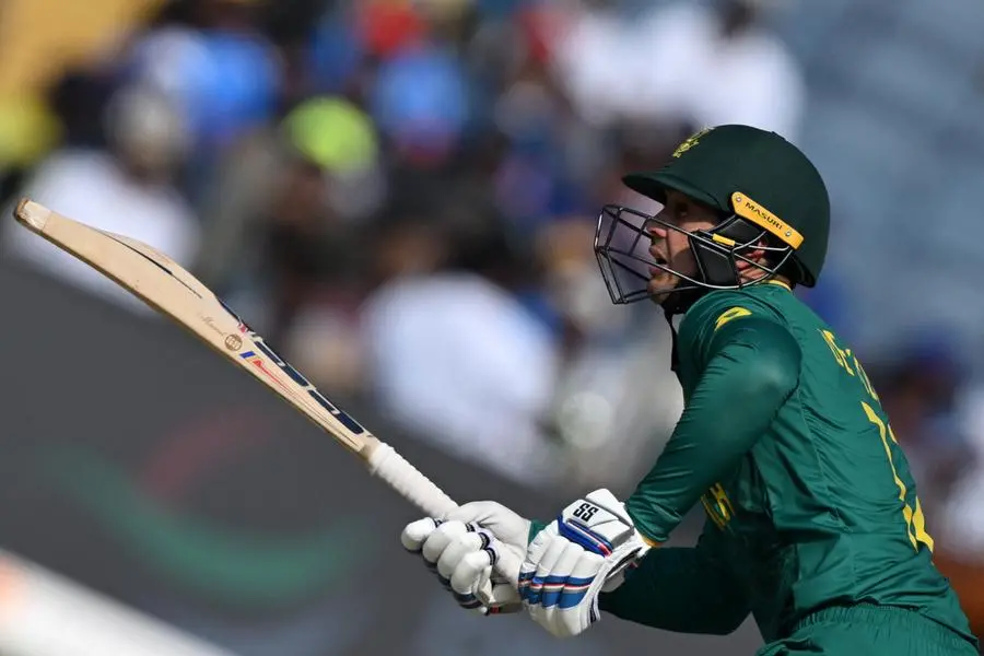 South Africa\\'s Quinton de Kock watches the ball after playing a shot during the 2023 ICC Men\\'s Cricket World Cup one-day international (ODI) match between New Zealand and South Africa at the Maharashtra Cricket Association Stadium in Pune on November 1, 2023. (Photo by INDRANIL MUKHERJEE / AFP)