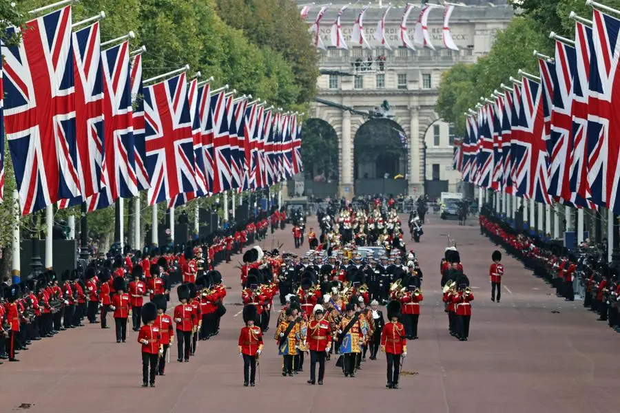 Pictured in the Procession is the State Gun Carriage, which was pulled by 142 Naval Ratings. The UK Armed Forces have played a part in the procession for Her Majesty The Queen’s funeral and committal service today, in London and Windsor. Marking the end to 10 days of proceedings, service personnel representing a variety of regiments, ships and air stations that held a special relationship with Her Majesty The Queen took part in the funeral processions in London and Windsor. Around 4,000 regular and reserve soldiers, sailors, marines and aviators, as well as musicians from Armed Forces bands, took part in the proceedings today. This included over 3,000 military personnel in central London, with 1,650 personnel forming part of the procession from the Palace of Westminster to Westminster Abbey and procession from Westminster Abbey to Wellington Arch. In Windsor, over 1,000 military personnel were involved in ceremonial activity, including 410 taking part in the procession from Albert Road, Windsor, to St George’s Chapel, Windsor Castle. POPhot Will Haigh/Pool via REUTERS