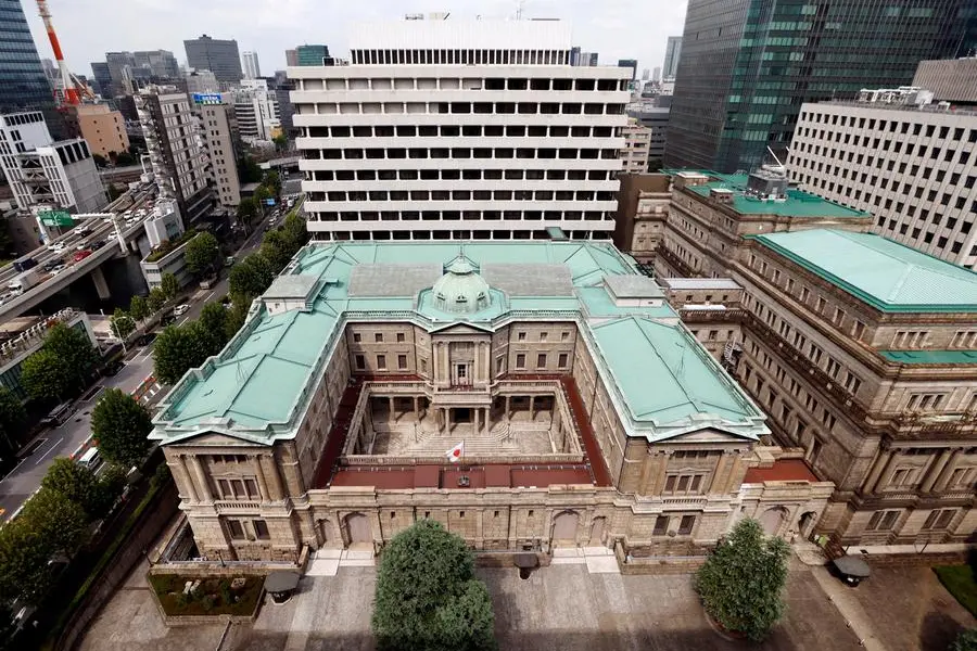 FILE PHOTO: Japanese national flag is hoisted atop the headquarters of Bank of Japan in Tokyo, Japan September 20, 2023. REUTERS/Issei Kato. , Reuters