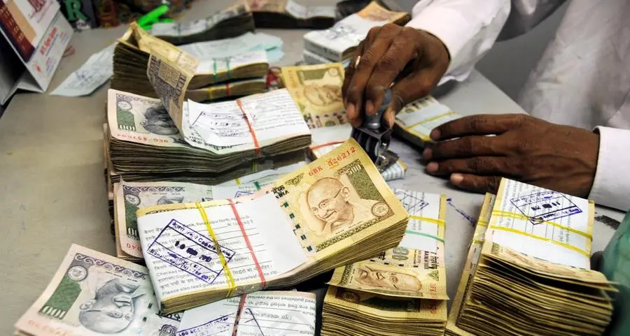 Indian rupee caught between equity outflows, Asia relief