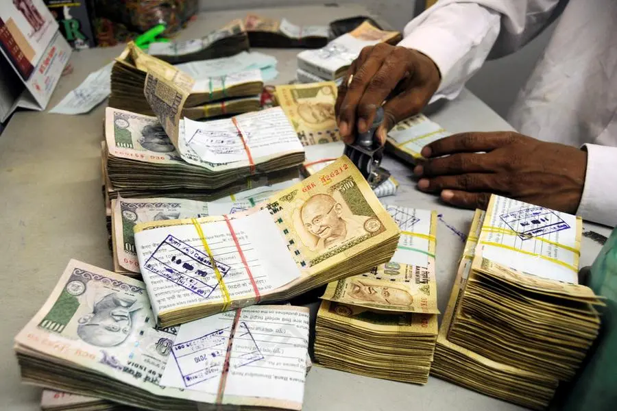 Indian rupee ends mildly lower on foreign banks' dollar buys; forward premiums decline