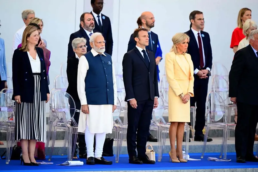 (From L) French National Assembly president Yael Braun-Pivet, India\\'s Prime Minister Narendra Modi, France\\'s President Emmanuel Macron and France\\'s first lady Brigitte Macron attend the Bastille Day military parade on the Champs-Elysees avenue in Paris on July 14, 2023. (Photo by Emmanuel DUNAND / POOL / AFP) , Agence France-Presse (AFP)/AFP