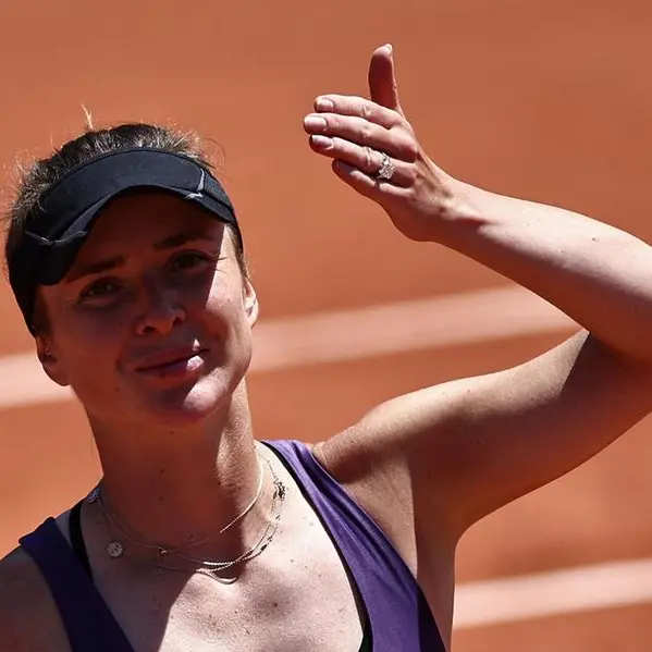 Svitolina fights back to reach French Open third round