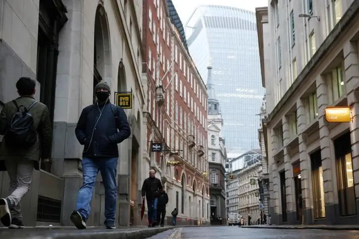 People walk through the City of London financial district, amid the coronavirus disease (COVID-19) outbreak, in London, Britain, March 4, 2021. REUTERS/Henry Nicholls , Reuters Images/REUTERS