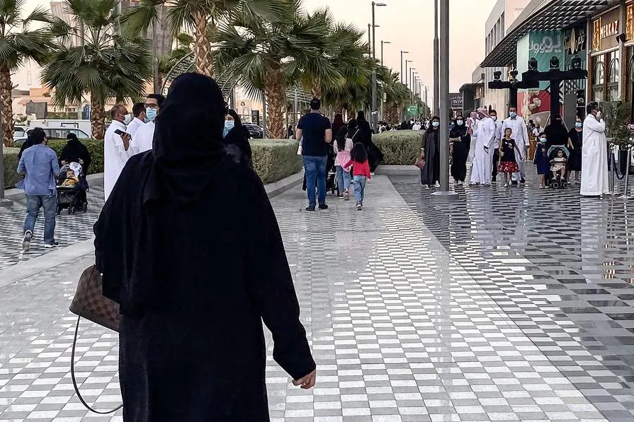 A woman walks along a promenade outside a shopping centre in Saudi Arabia\\'s capital Riyadh on October 31, 2020. (Photo by FAYEZ NURELDINE / AFP) Image used for illustrative purpose.