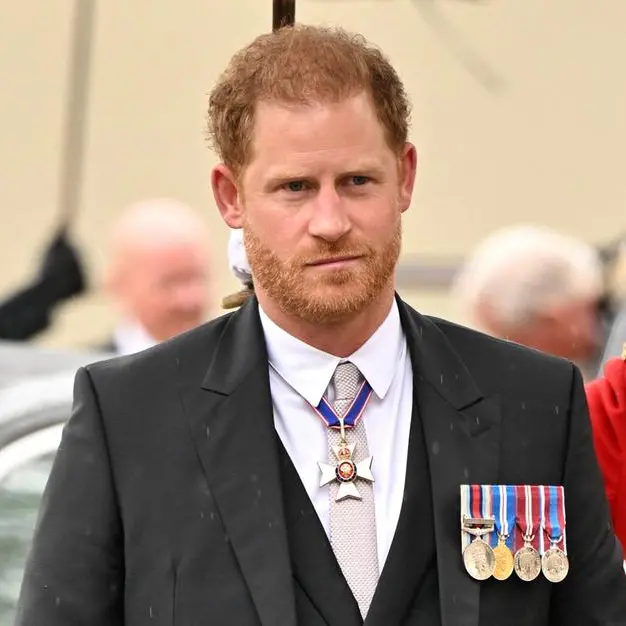 Smiling Prince Harry arrives at Westminster Abbey