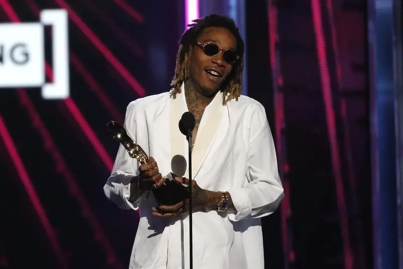 Wiz Khalifa accepts the award for Top Hot 100 Song for \"See You Again\" at the 2016 Billboard Awards in Las Vegas, Nevada, U.S., May 22, 2016. REUTERS/Mario Anzuoni - RTSFG64 , Mario Anzuoni - RTSFG64