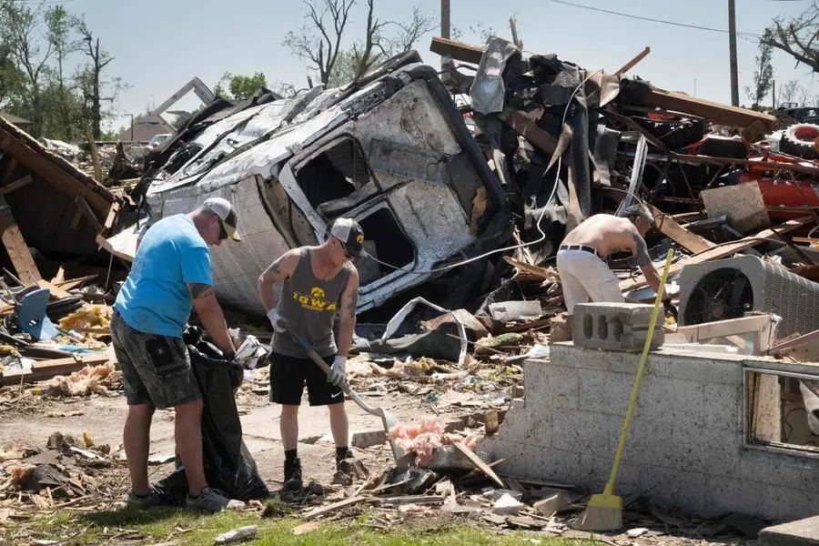 At least 14 dead in US tornadoes, storms