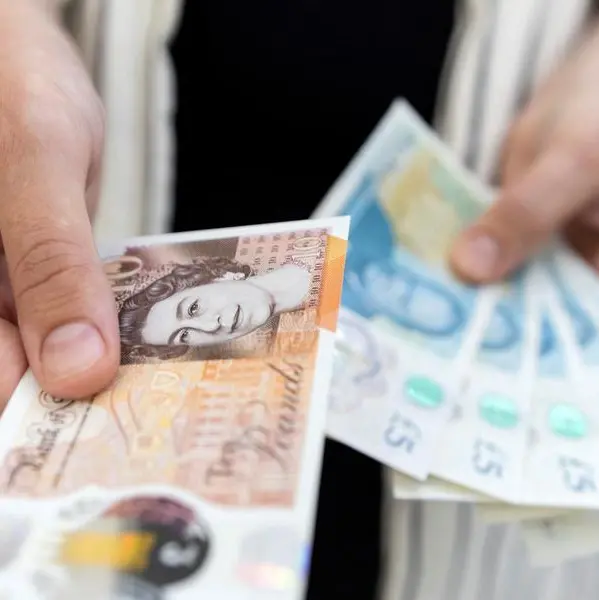 Sterling dips as investors book profits on scorching rally