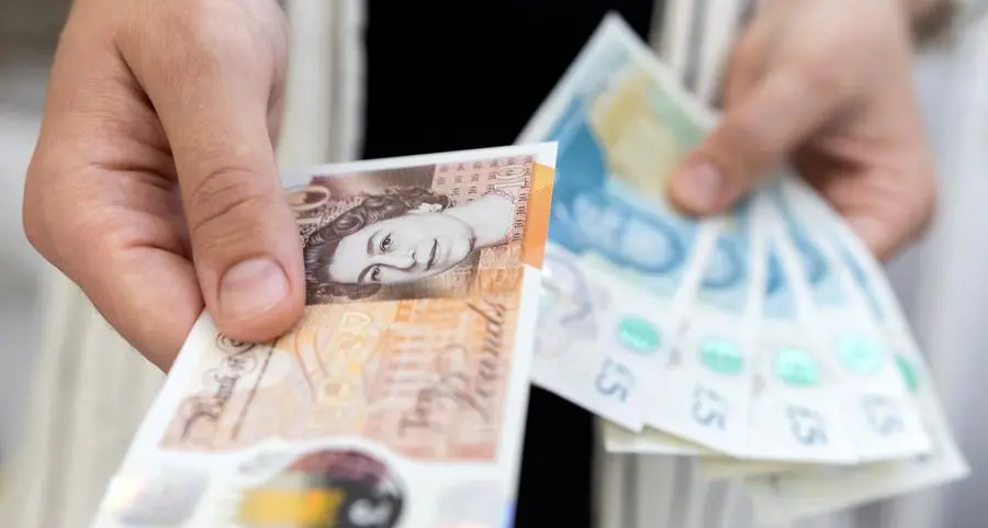 Sterling dips as investors book profits on scorching rally
